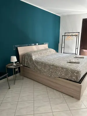 Letto o letti in una camera di San Damiano Inn