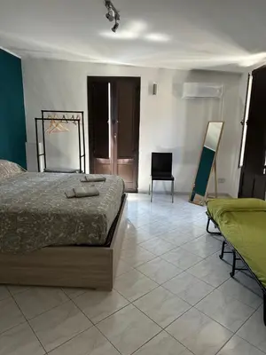Letto o letti in una camera di San Damiano Inn