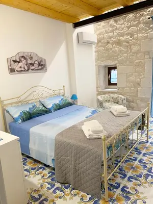 Letto o letti in una camera di IL RIFUGIO BAROCCO