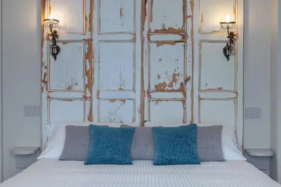 Letto o letti in una camera di Biuti Suite Apartment