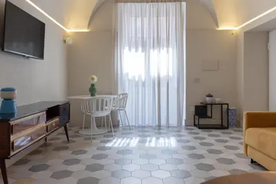 TV o dispositivi per l'intrattenimento presso Biuti Suite Apartment