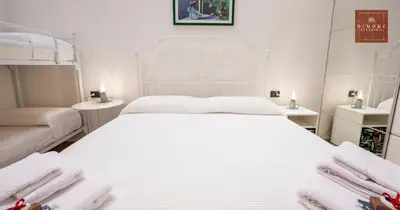 Letto o letti in una camera di Dimore Anna Maria -Il Magazzino-