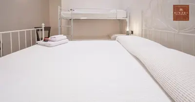 Letto o letti in una camera di Dimore Anna Maria -Il Magazzino-