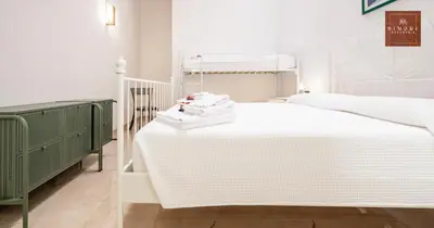 Letto o letti in una camera di Dimore Anna Maria -Il Magazzino-