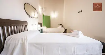 Letto o letti in una camera di Dimore Anna Maria -Il Magazzino-
