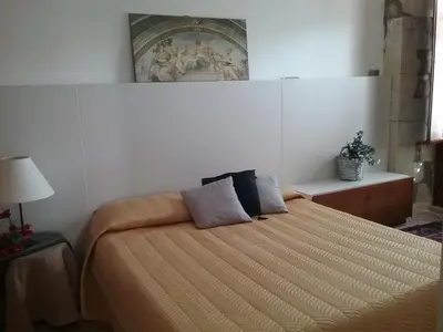 Letto o letti in una camera di Casa Milina