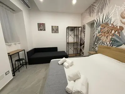 Letto o letti in una camera di IL VICOLO DI PAOLA