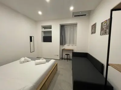 Letto o letti in una camera di IL VICOLO DI PAOLA