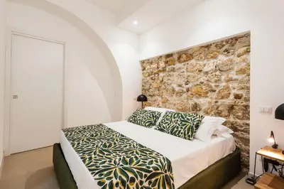 Letto o letti in una camera di Tra i Vicoli di Ortigia by Wonderful Italy