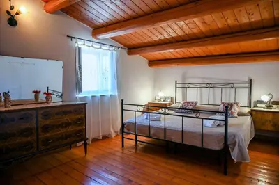 Letto o letti in una camera di Casa Acqua Veccia