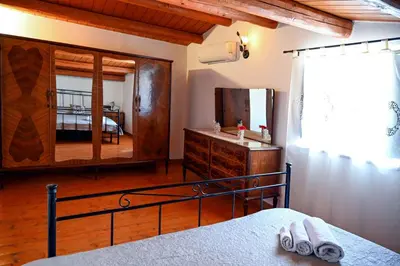 Letto o letti in una camera di Casa Acqua Veccia
