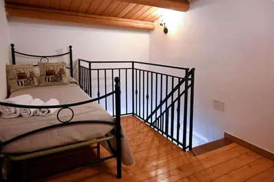 Letto o letti in una camera di Casa Acqua Veccia