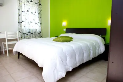Letto o letti in una camera di Azienda Agrituristica e Didattica CrauNari