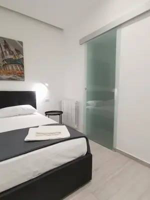 Letto o letti in una camera di Trinity Apartment