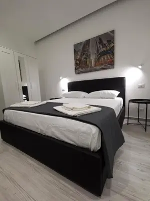 Letto o letti in una camera di Trinity Apartment