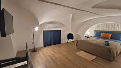 Letto o letti in una camera di MAISON VENTIMIGLIA 83
