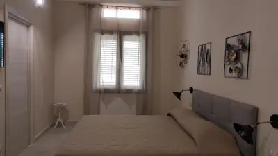 Letto o letti in una camera di Alla Corte di Dionisio