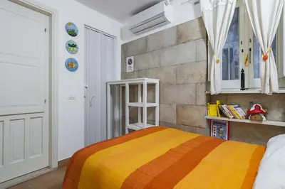 Letto o letti in una camera di La casa di Rosa 1833 by Wonderful Italy