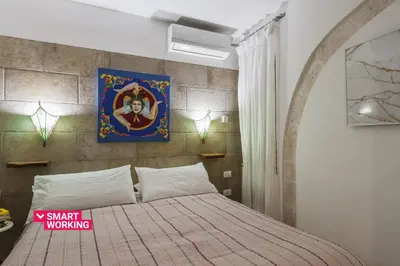 Letto o letti in una camera di La casa di Rosa 1833 by Wonderful Italy