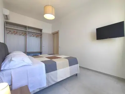 TV o dispositivi per l'intrattenimento presso Matteotti 16 - Modern Apartment in Ortigia