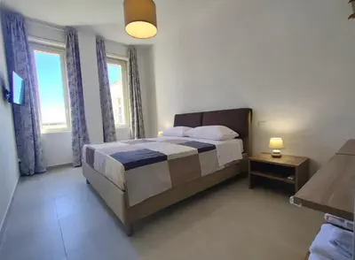 Letto o letti in una camera di Matteotti 16 - Modern Apartment in Ortigia