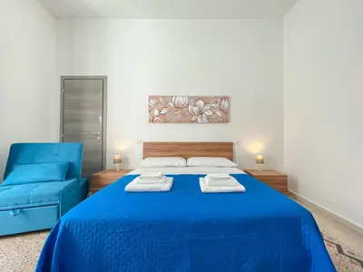 Letto o letti in una camera di Clizia Apartment