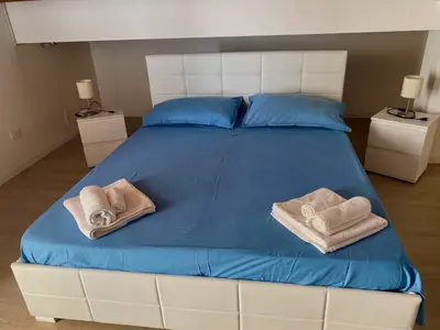 Letto o letti in una camera di Casetta Lulu con terrazza vista mare