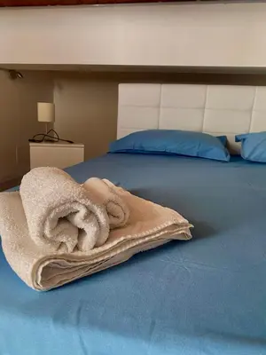 Letto o letti in una camera di Casetta Lulu con terrazza vista mare