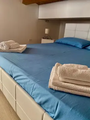 Letto o letti in una camera di Casetta Lulu con terrazza vista mare