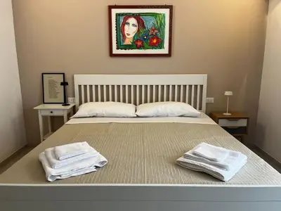 Letto o letti in una camera di La casa della poesia