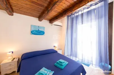 Letto o letti in una camera di B&B Villa Pia