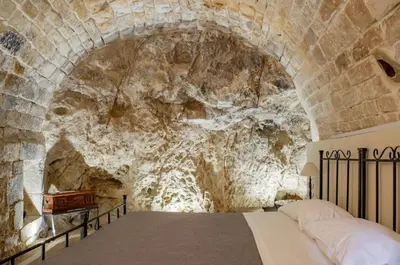 Letto o letti in una camera di Domum in petra casa nella roccia Self check - in