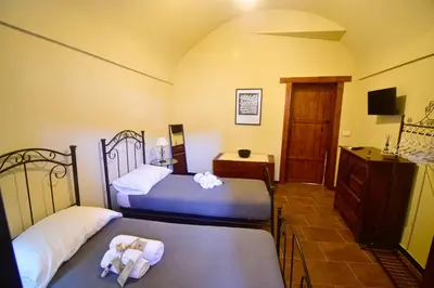 Letto o letti in una camera di Domum in petra casa nella roccia Self check - in