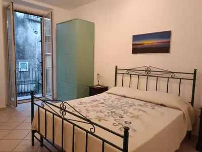 Letto o letti in una camera di La casa nel vicolo