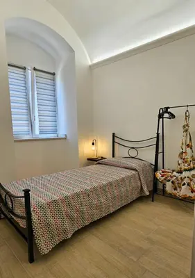 Letto o letti in una camera di L'amurusa