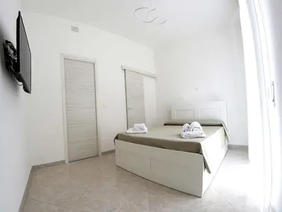 Letto o letti in una camera di Sikelia holiday house