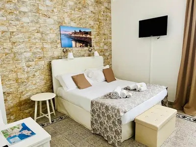 Letto o letti in una camera di Made in Ortigia Apartments