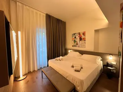 Letto o letti in una camera di Palazzo Sangiorgio