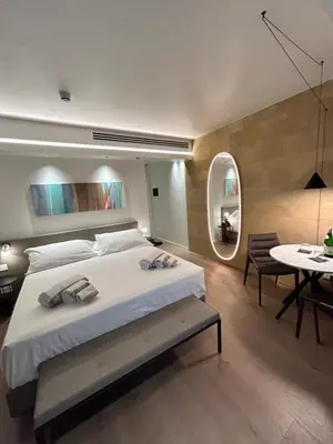 Letto o letti in una camera di Palazzo Sangiorgio