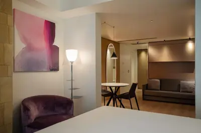 Letto o letti in una camera di Palazzo Sangiorgio