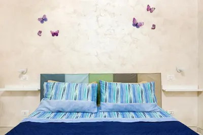 Letto o letti in una camera di Casa Valentina