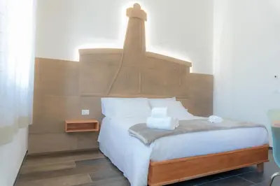 Letto o letti in una camera di RUDINI' CHARMING ROOM