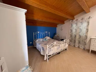 Letto o letti in una camera di Villa Carratois