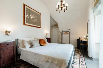 Letto o letti in una camera di Officine degli Aromi