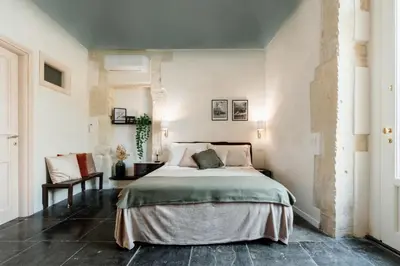 Letto o letti in una camera di Officine degli Aromi
