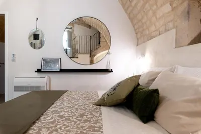 Letto o letti in una camera di Officine degli Aromi