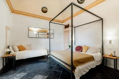 Letto o letti in una camera di Officine degli Aromi