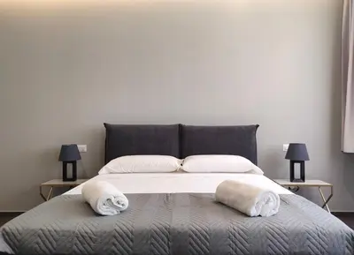 Letto o letti in una camera di Nine Sweet Rooms