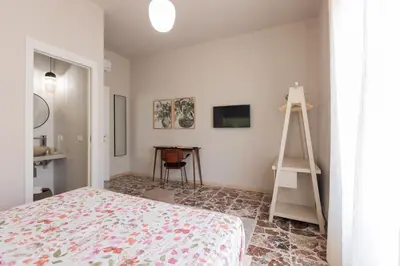 Letto o letti in una camera di Central House palazzo Brafa una camera di albergo