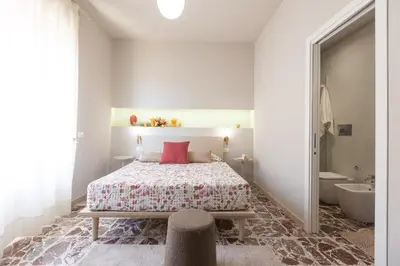 Letto o letti in una camera di Central House palazzo Brafa una camera di albergo